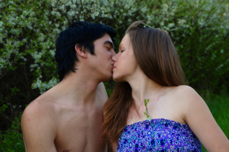 Fresh young slut girl broad and her bf have sex on green grass near blooming bushes
