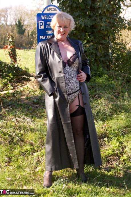 Grandma Claire Knight wears a coat with nothing but cute lingerie underneath