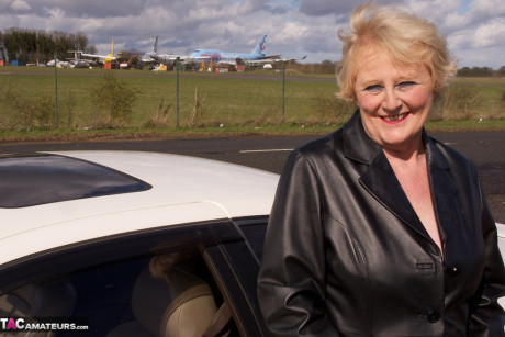 Grandma Claire Knight wears a coat with nothing but cute lingerie underneath