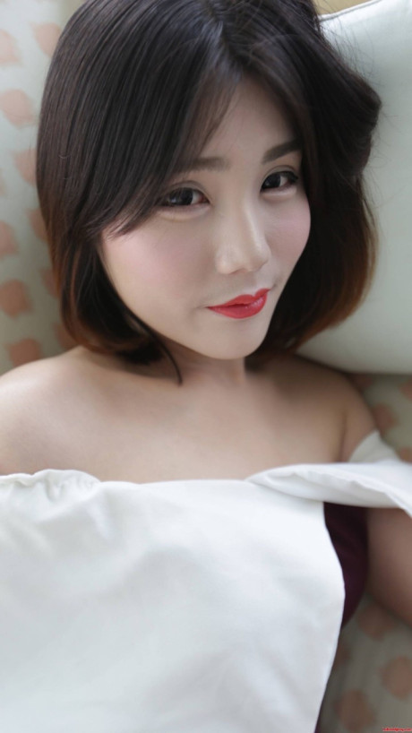 Brunette asian transsexual exposes her tiny melons and poses in underwear