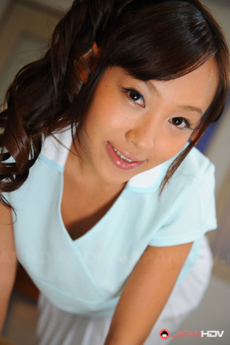 Pigtailed chinese beauty Nagisa posing in her attractive lovely outfit on the cam