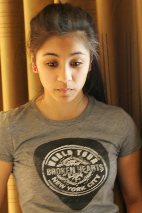 Beautiful Arab young model posing in her shirt and tight jeans at a casting