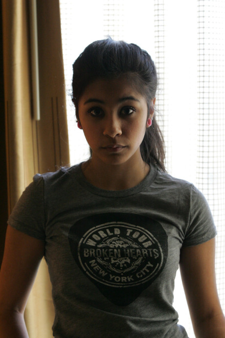 Beautiful Arab young model posing in her shirt and tight jeans at a casting