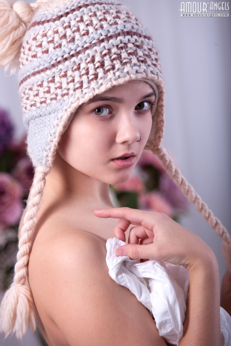 Adorable teenie Sandra strikes tempting solo pose in toque and footless leggings