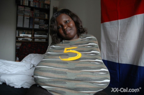Wide ebony girl Mariana Kodjo showing off her gigantic natural titties