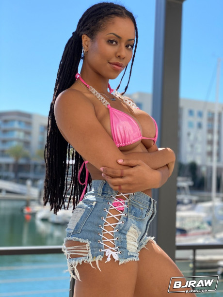 Curvy black Kira Noir exposes her firm fake tits before a blowjob & monstrous facial