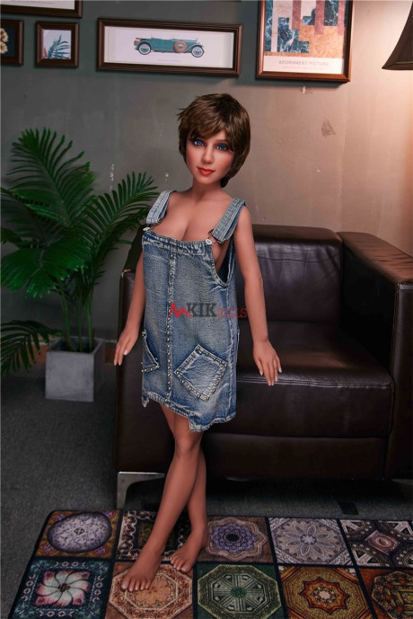 Skinny sex doll Sally shows off her nice bum and big breasts in the lamplight