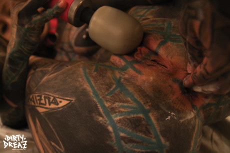 Heavily tattooed bitch GF girl fists her vagina after masturbating with a sex toy