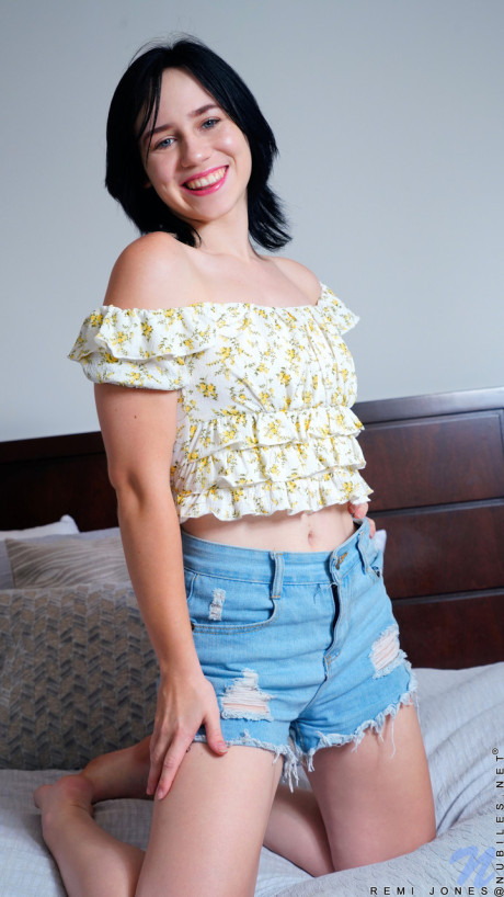 Cute brunette babe Remi Jones undresses and rides her muff with a toy