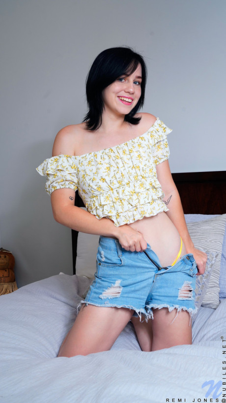 Cute brunette babe Remi Jones undresses and rides her muff with a toy