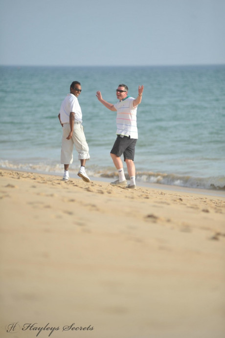 Hayley Marie Coppin and her thick girl go bare-breasted at the beach in sunglasses