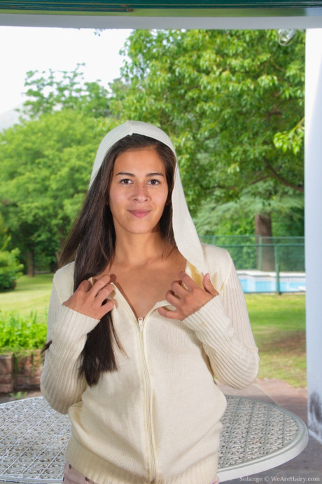 Adorable amateur young Solange stripping nude and showing her silky bush