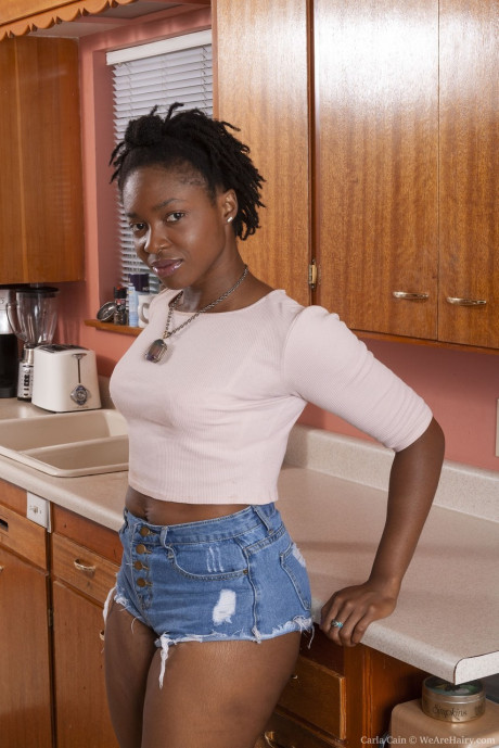 Ebony amateur Carla Cain shows her unshaven underarms and beaver