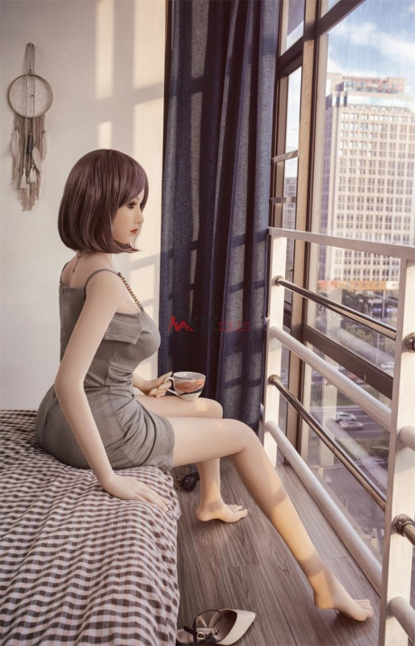 Ravishing chinese sex doll shows her flawless stacked body in a sweet dress