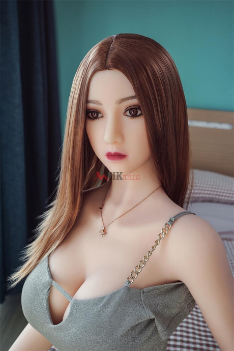 Ravishing chinese sex doll shows her flawless stacked body in a sweet dress
