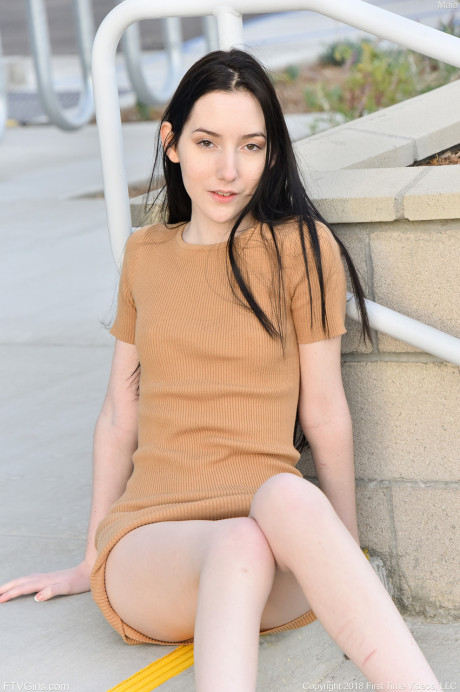 Glamour babe Maia showing her tiny breasts & spreading her trimmed cunt outdoors