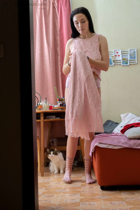 Tall brunette Elza flashing her tight behind & her humongous areolas while dressiing