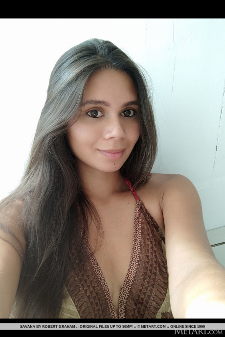 Ravishing French brunette Savana takes selfies as she strolls around the