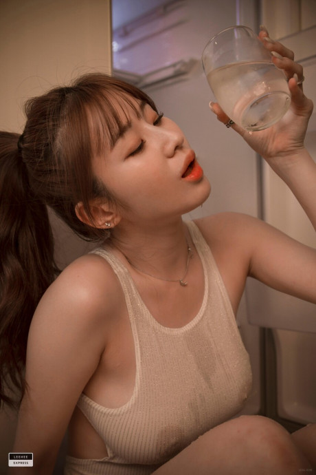 Marvelous South Korean model flaunts her giant boobies while posing in her swimsuit