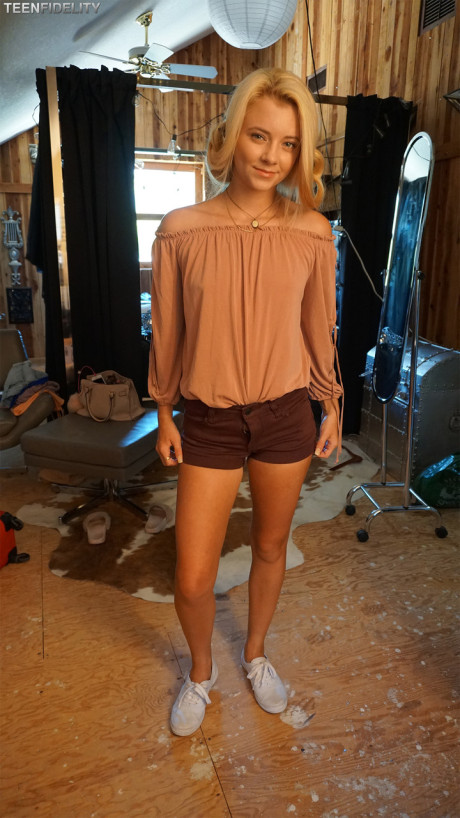 Hot blonde teenie models her tiny tits & thin figure in charming outfits