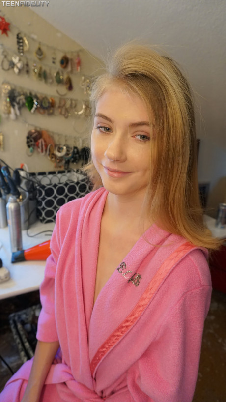 Hot blonde teenie models her tiny tits & thin figure in charming outfits
