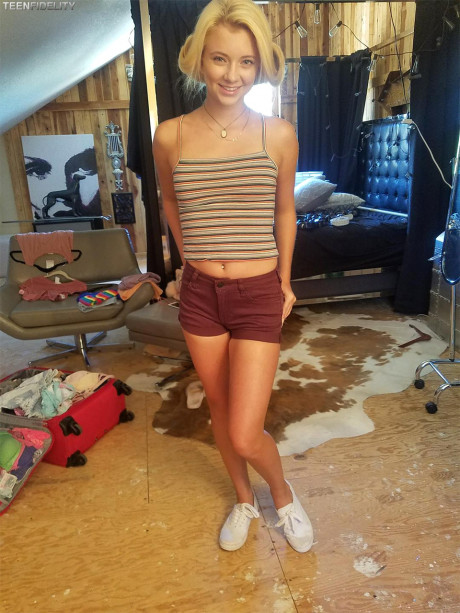 Hot blonde teenie models her tiny tits & thin figure in charming outfits