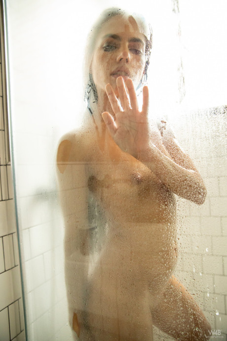 European teenie Apolonia shows her hot bum and poses in the shower