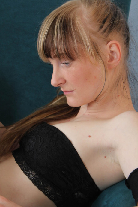 Lovely amateur goes topless while teasing in pantyhose and high heels