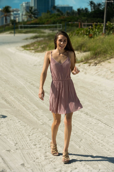 Delicious teenie Mackenzie strips undressed and poses shamelessly on the beach