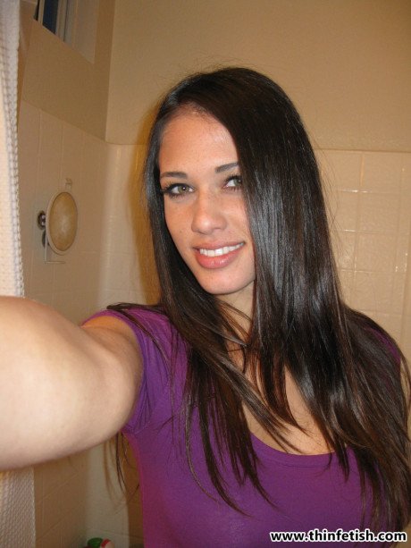 Petite slut gf woman Tiffany Thompson takes naked selfies in a bathroom mirror