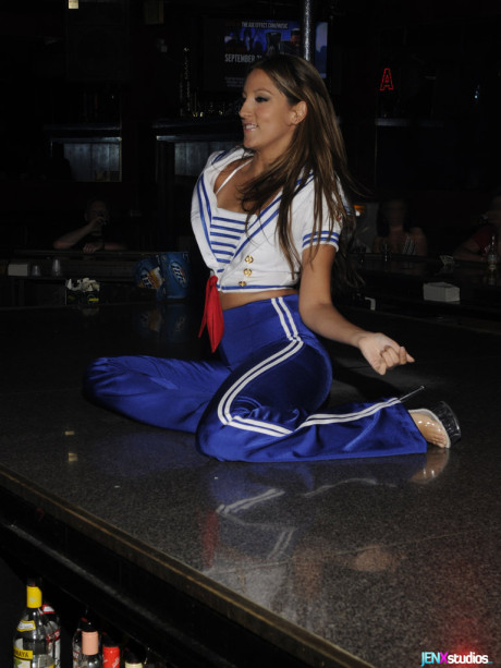 Caucasian stripper salutes before peeling off her clothes onstage