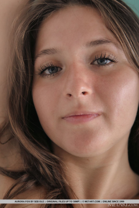 Nice teenie Aurora Fox takes off a red bra and thong to pose totally undressed