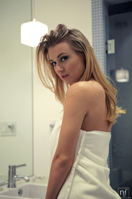 Cute blondie Natalia Star showing off giant melons and enormous nipples in the shower