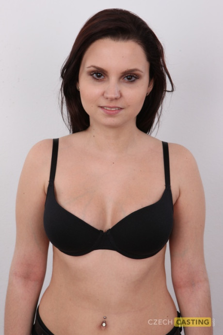 Brunette amateur takes off her clothes and shoes to model in the naked