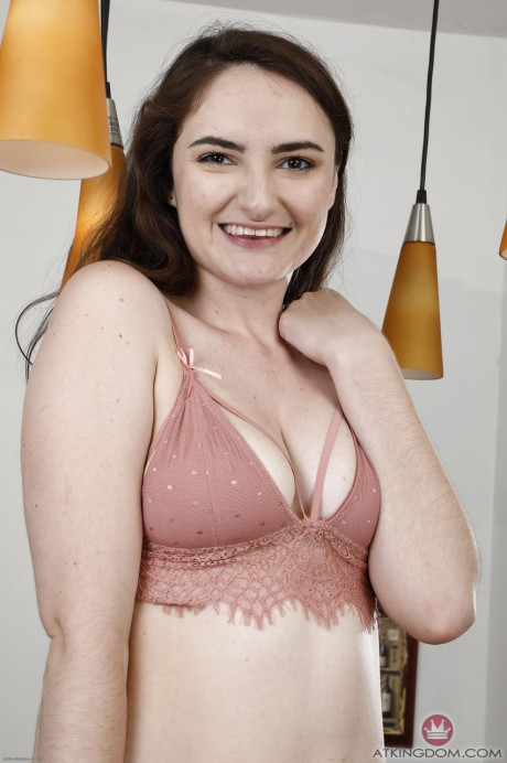 Young teenie amateur Luci Lovett twists her nipples and stretches her hairy pussy