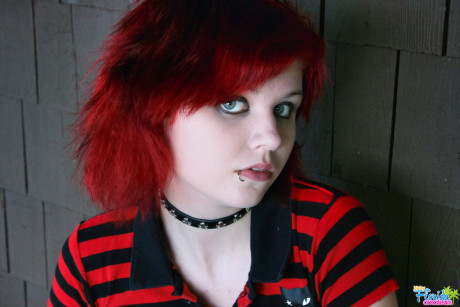 Fine redheaded bitch GF woman teen Satine uncovers her small tits on a rustic porch