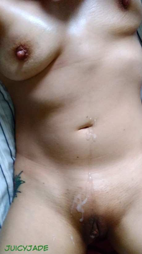 Busty oriental whore lady Jasmine Jade gets sperm on her abdomen and pussy