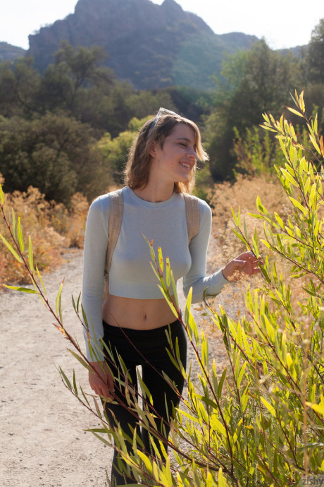 Fine teen next door April Grantham posing nude in a secluded nature park