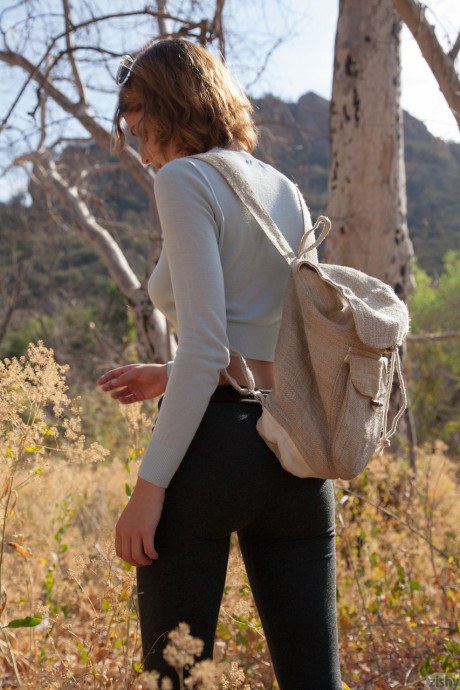 Fine teen next door April Grantham posing nude in a secluded nature park