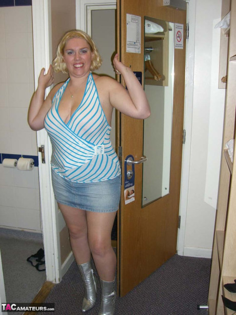 Mature blonde Barby swallows off a penis after getting undressed in a hotel room