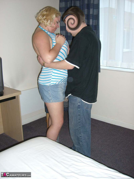 Mature blonde Barby swallows off a penis after getting undressed in a hotel room