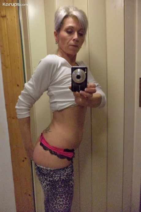 Czech skank chick Kathy White taking selfies in the mirror while stripping