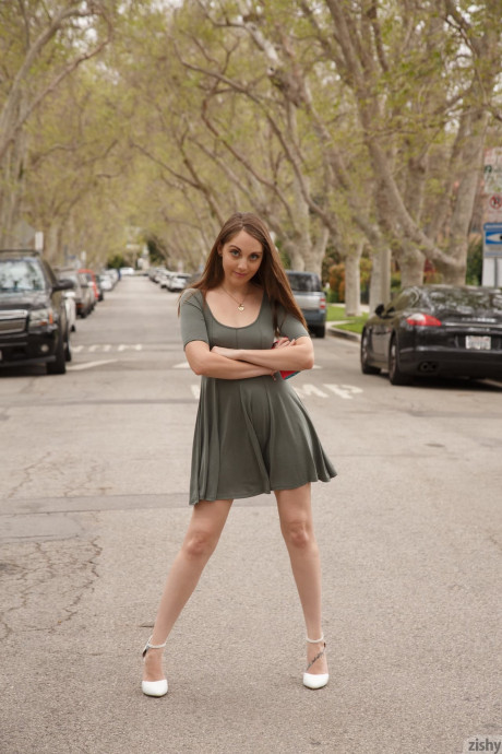 Kinky brunette Nickey Huntsman flashes her melons and ass while out in public