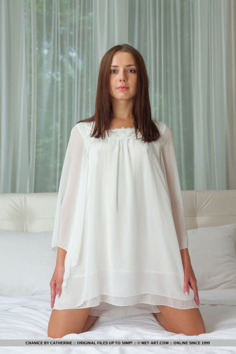 Young young glamour model Chanice slipping off white nighty to pose in the nude