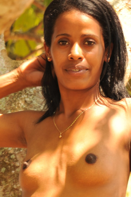 Filthy black with tiny tits Arish flaunts her small butt and slim body outdoors