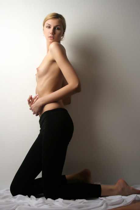 Small titted teen Layla S shows her cute figure and poses nude