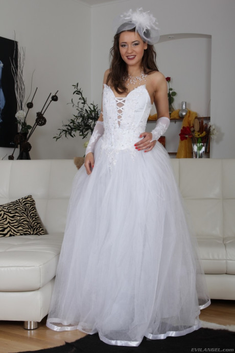 Brunette bride Savannah Secret lifts her wedding dress up and show hairy pussy