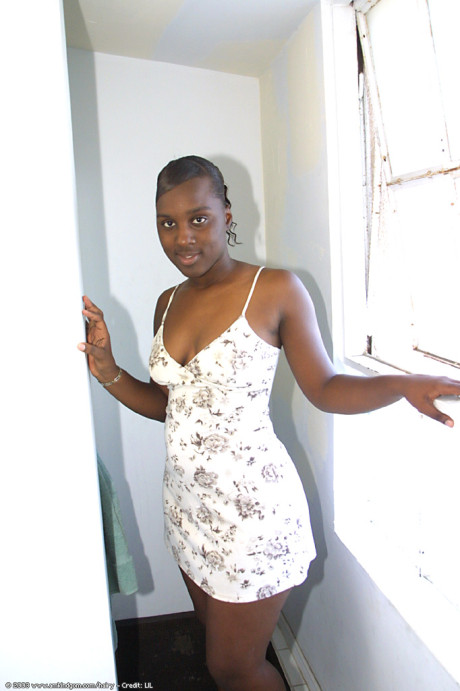 Black babe Peaches unveils her boobs & large behind before spreading her silky twat