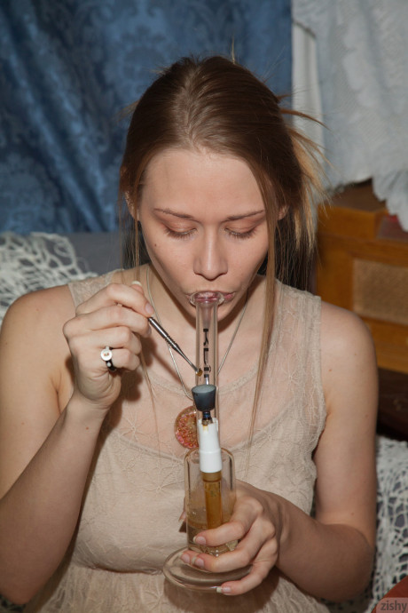 Young girl Gloria Paquette smokes pot and flaunts her cute melons