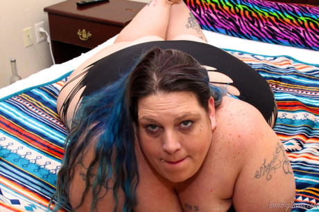 Solo model BBW Devious displays her layers of chunky in revealing undergarment